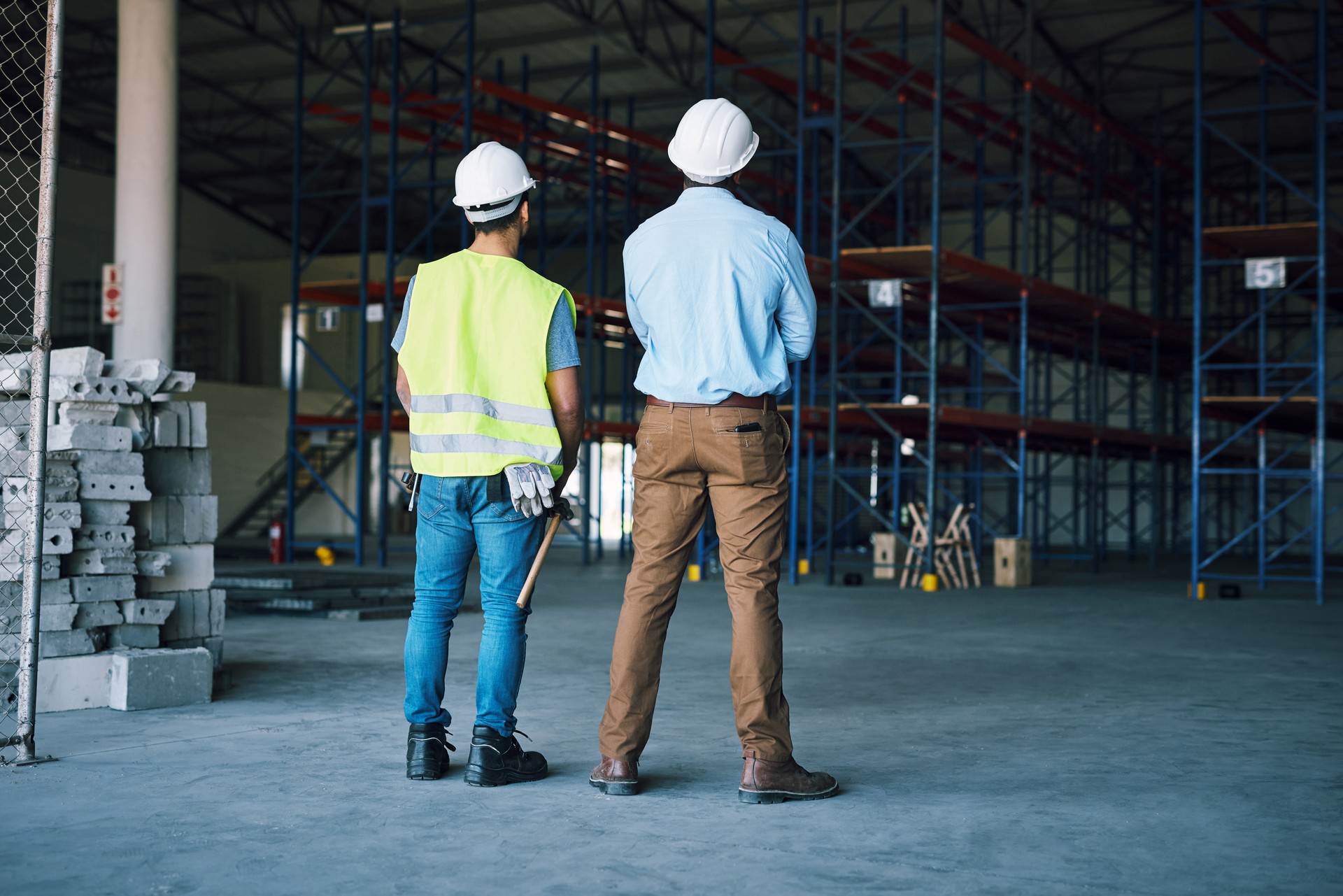 Shot of two builders inspecting a construction site